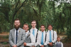 groomsmen turquoise ties and suspenders, gray pants. 